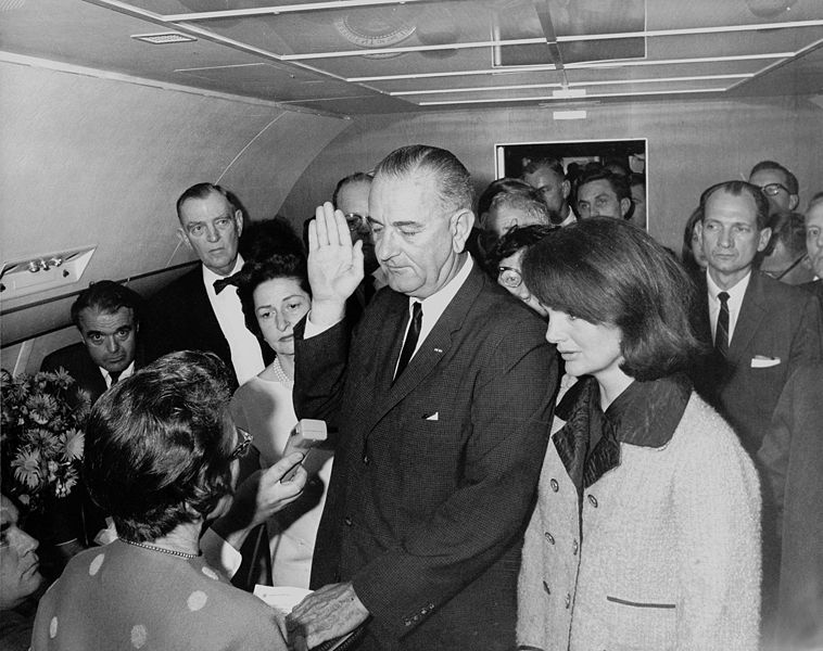 Lyndon B. Johnson taking the oath of office, November 1963. Cecil Stoughton.